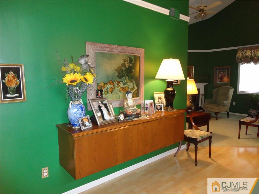 29 Winthrop Road Monroe Township, NJ 08831 - Photo 6 of 25 a living room with furniture and a flat screen tv