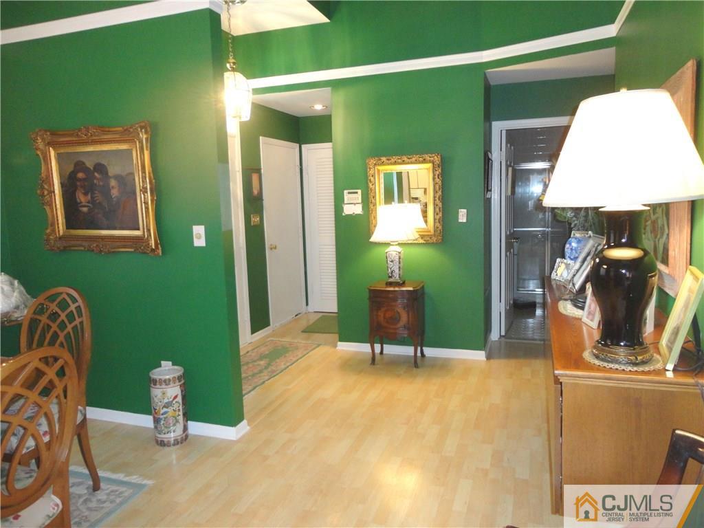 29 Winthrop Road Monroe Township, NJ 08831 - Photo 8 of 25 a living room with furniture and a lamp