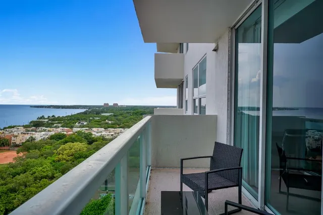 a view of balcony with wooden floor
