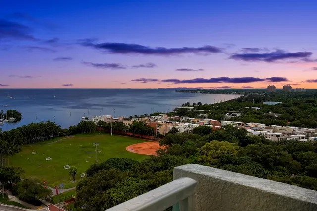 a view of a lake with sunset