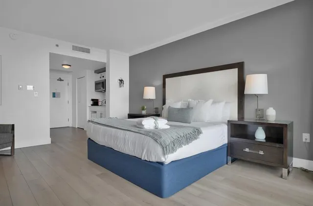 a bedroom with a bed and a table