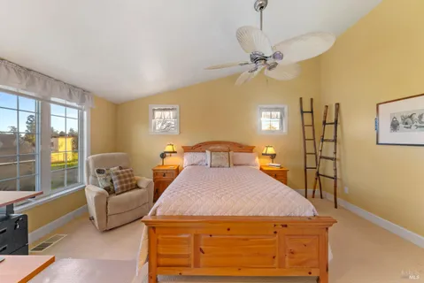 a large bathroom with a double vanity sink a large mirror and a bathtub