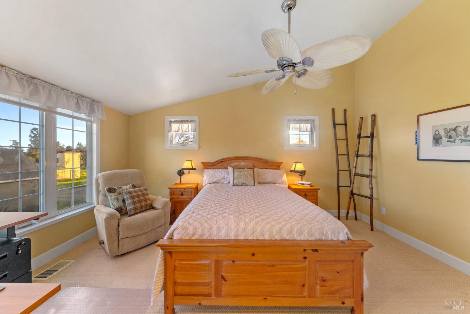 1245 Castle Road Sonoma, CA 95476 - Photo 21 of 48 a bedroom with a bed and wooden floor