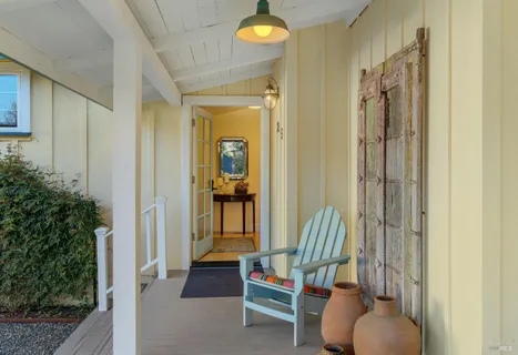 a view of living room with furniture and lamp