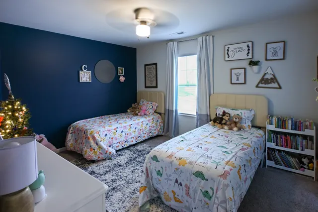 a view of walk in closet with clothes