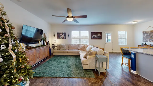 a kitchen with stainless steel appliances granite countertop a sink refrigerator and cabinets