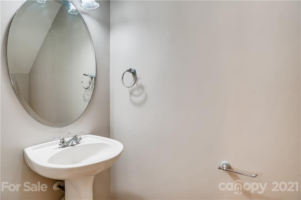 3115 Tanzanite Circle Fort Mill, SC 29708 - Photo 26 of 33 a bathroom with a sink and a mirror