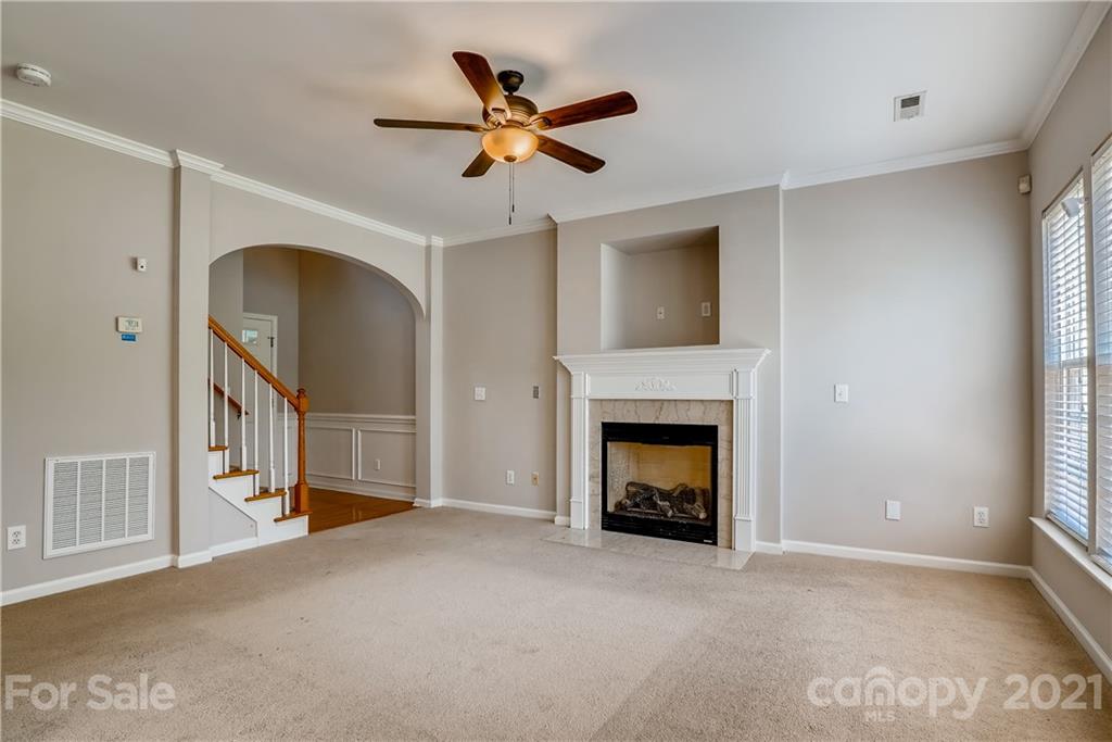 3115 Tanzanite Circle Fort Mill, SC 29708 - Photo 7 of 33 a living room with furniture and a fireplace
