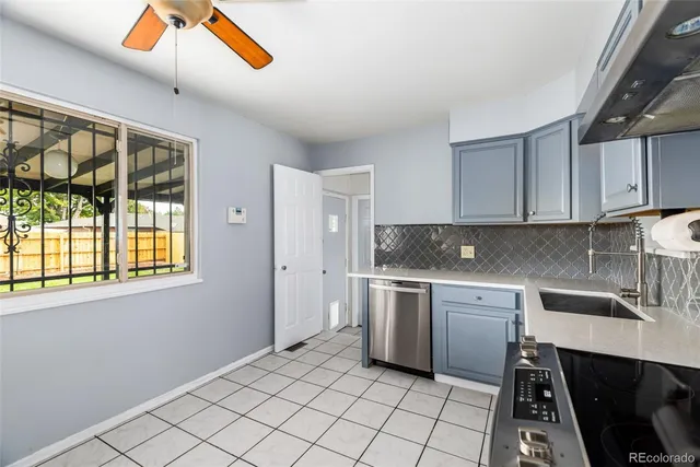 a kitchen with a sink cabinets and window