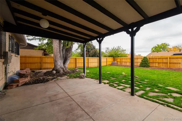 a view of a street with an outdoor seating