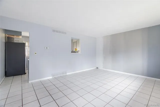 a view of an empty room and window