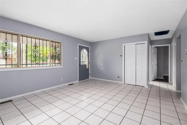 a view of an empty room and window