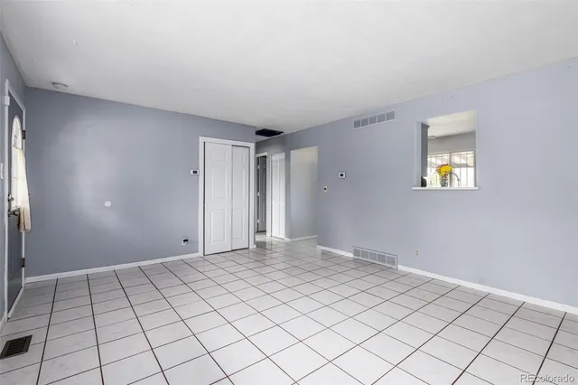 a view of an empty room and window