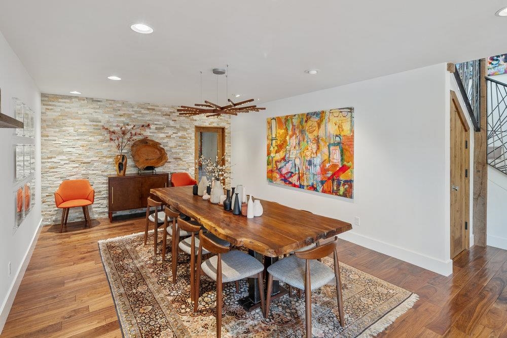 700 Olympic Vly Road Olympic Valley, CA 96146 - Photo 16 of 28 a view of a dining room with furniture a rug and wooden floor