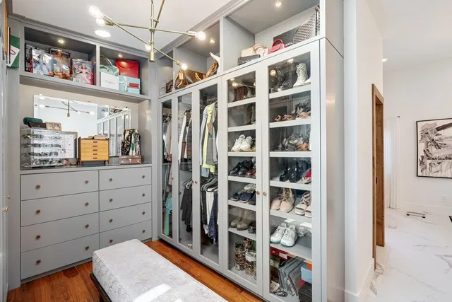 a spacious bathroom with a double vanity sink a mirror and a shower
