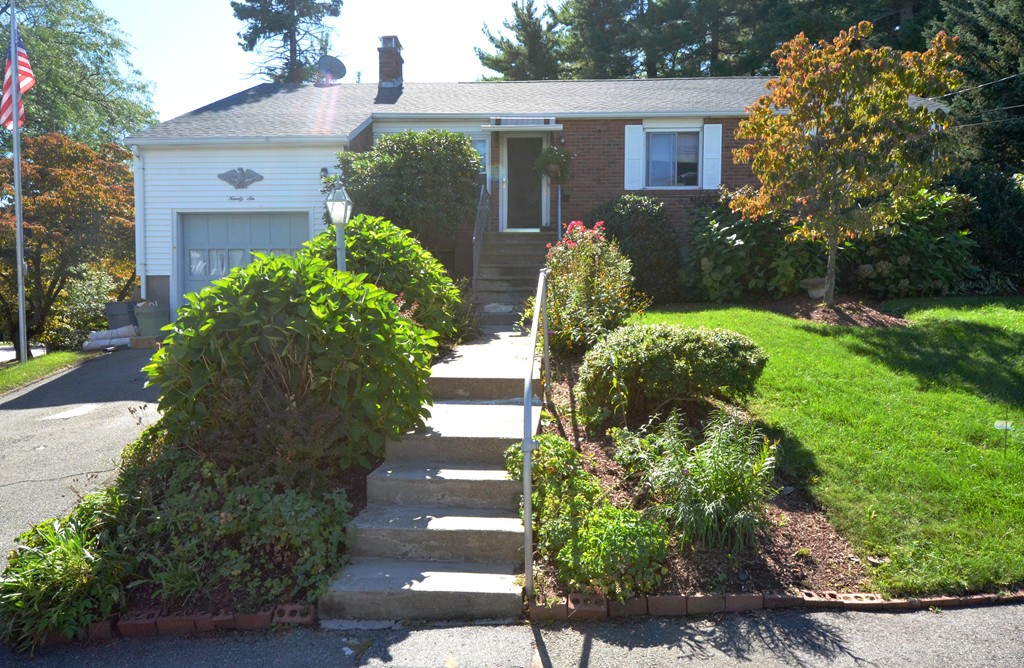 front view of a house with a yard