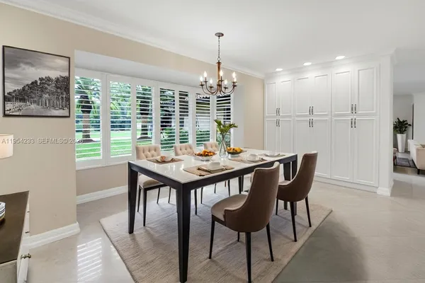 a view of a dining room with furniture window and outside view