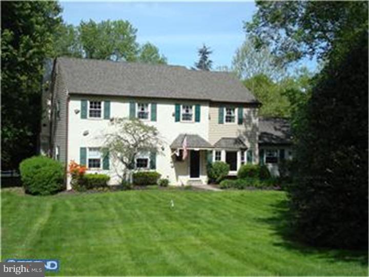 927 Hunt Road Radnor, PA 19008 - Photo 1 of 23 a front view of a house with a garden and plants