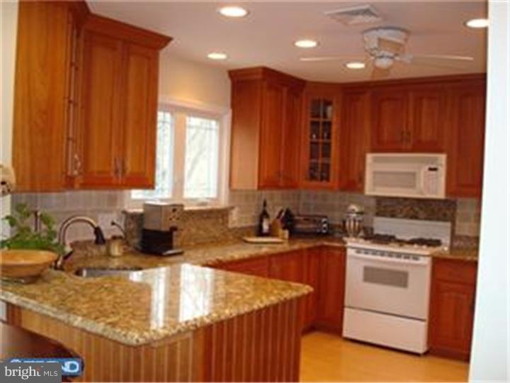 927 Hunt Road Radnor, PA 19008 - Photo 12 of 23 a kitchen with sink a stove and cabinets