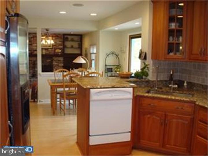 927 Hunt Road Radnor, PA 19008 - Photo 13 of 23 a kitchen with center island table and chairs