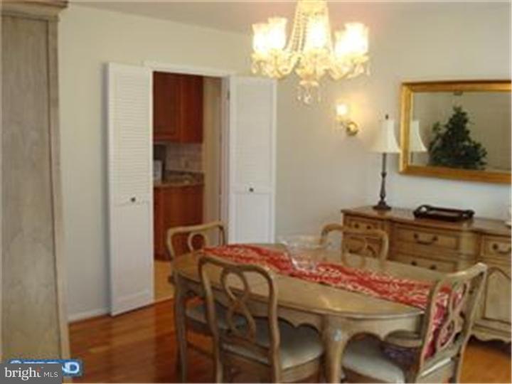 927 Hunt Road Radnor, PA 19008 - Photo 14 of 23 a bedroom with a bed and a mirror