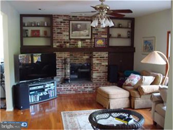 927 Hunt Road Radnor, PA 19008 - Photo 17 of 23 a living room with furniture and a fireplace