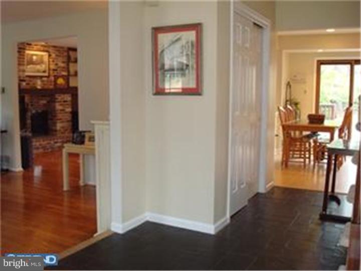 927 Hunt Road Radnor, PA 19008 - Photo 3 of 23 a view of a hallway with furniture and floor to ceiling window