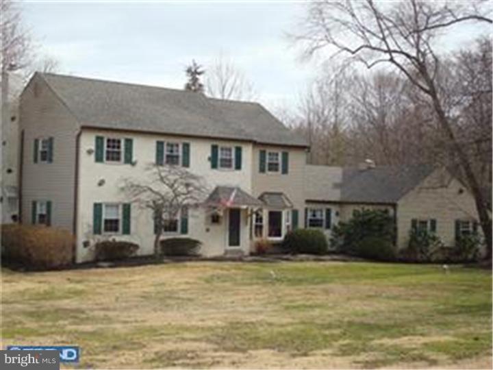927 Hunt Road Radnor, PA 19008 - Photo 22 of 23 a front view of a house with large trees
