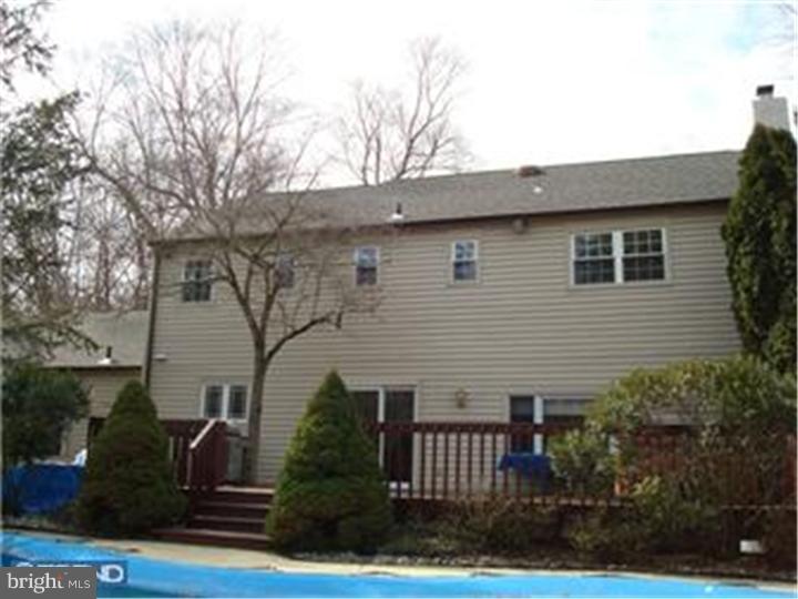927 Hunt Road Radnor, PA 19008 - Photo 23 of 23 a front view of a house with garden