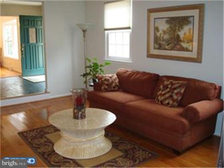 927 Hunt Road Radnor, PA 19008 - Photo 6 of 23 a living room with furniture and a window