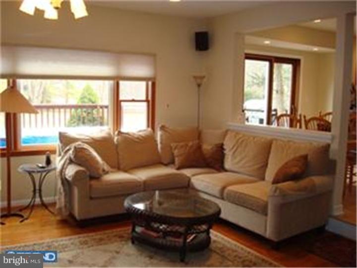 927 Hunt Road Radnor, PA 19008 - Photo 7 of 23 a living room with furniture and a large window
