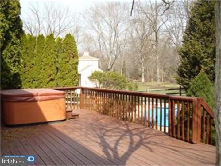 927 Hunt Road Radnor, PA 19008 - Photo 10 of 23 a balcony with wooden floor and fence