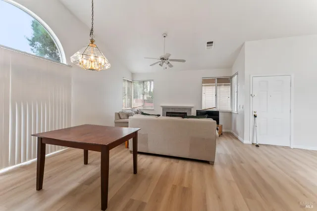 a kitchen with stainless steel appliances kitchen island granite countertop a sink stove and cabinets