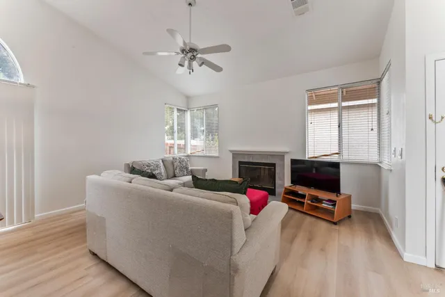 a living room with furniture and a fireplace