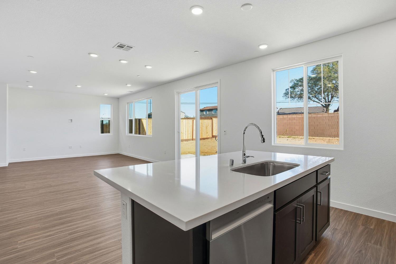1031 Slalom Way Lincoln, CA 95648 - Photo 3 of 12 a kitchen with sink and mirror
