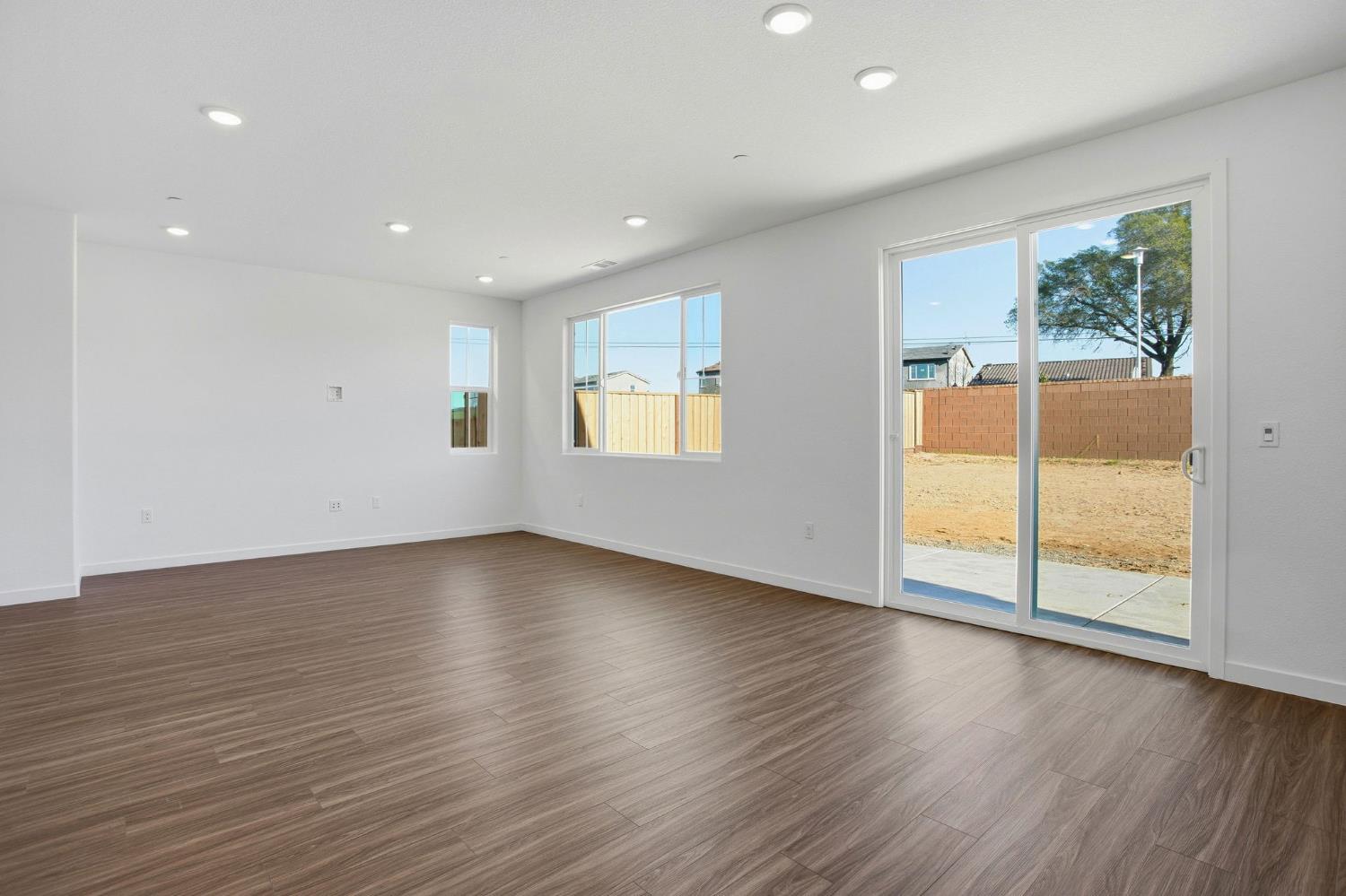 1031 Slalom Way Lincoln, CA 95648 - Photo 4 of 12 a view of an empty room with wooden floor and a window