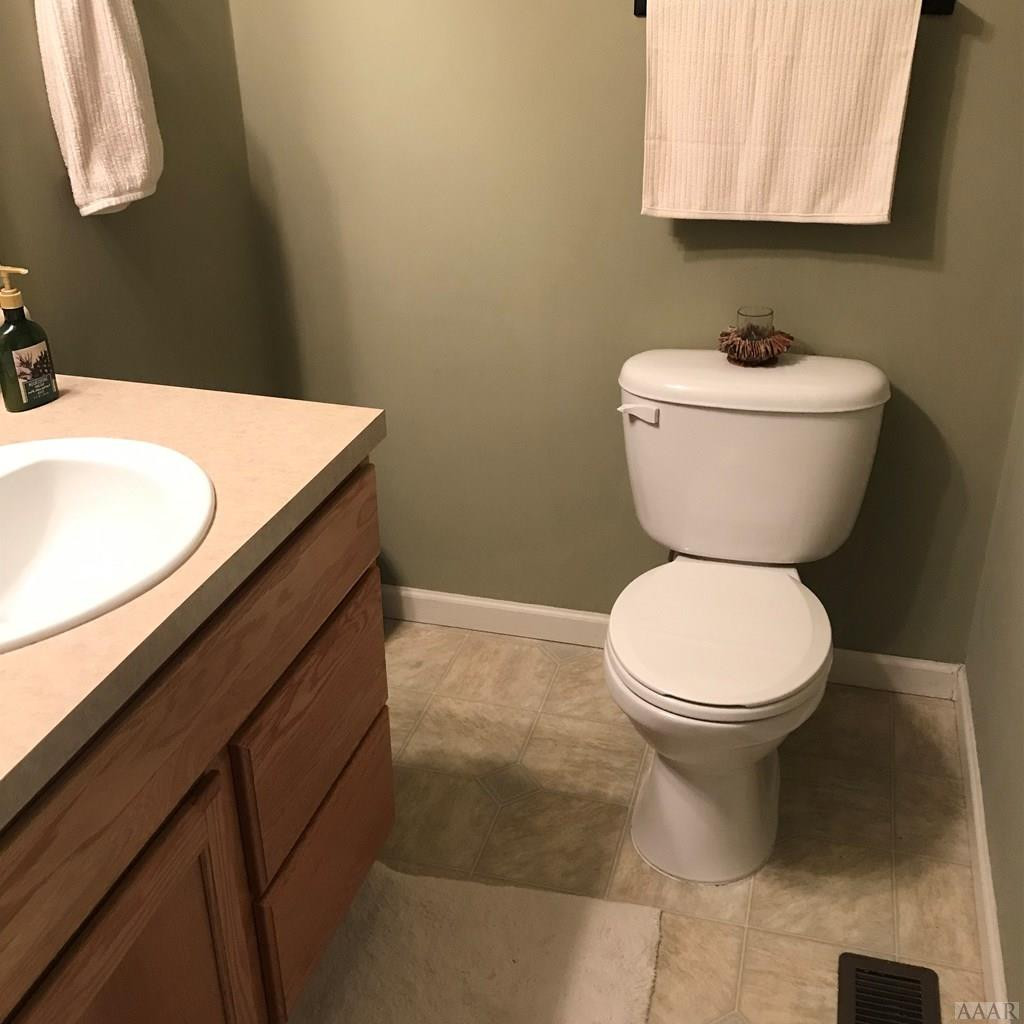 163 Guinea Road Moyock, NC 27958 - Photo 11 of 18 half bath downstairs