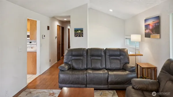 a living room with furniture and a rug