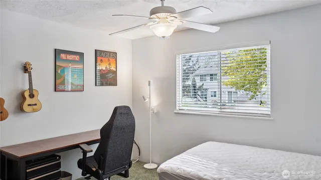 a bedroom with a workspace