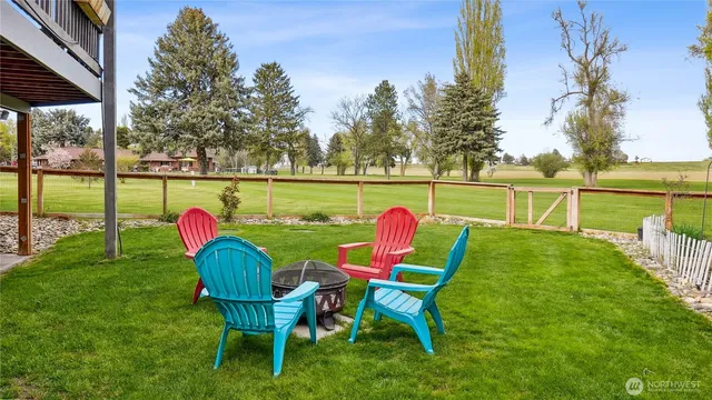 a view of a table and chairs on the deck