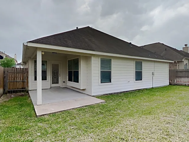a front view of house with yard and porch