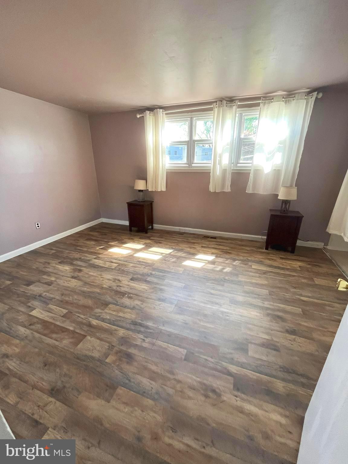 12205 Rambler Road Philadelphia, PA 19154 - Photo 9 of 18 a view of empty room with wooden floor and fan