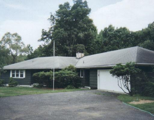 172 George Washington Highway Ridgefield, CT 06877 - Photo 1 of 1 a front view of a house with a garden and yard