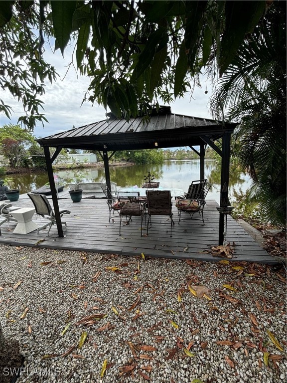3048 Lunar Street Naples, FL 34112 - Photo 13 of 19 a view of a patio with a table chairs and a large tree