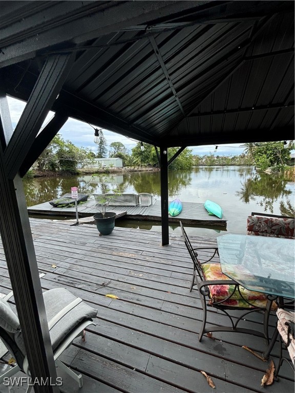 3048 Lunar Street Naples, FL 34112 - Photo 15 of 19 a sitting area with furniture on wooden deck
