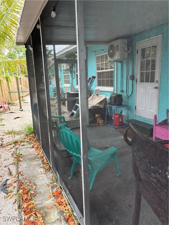 3048 Lunar Street Naples, FL 34112 - Photo 18 of 19 a view of porch with two chairs and a rug