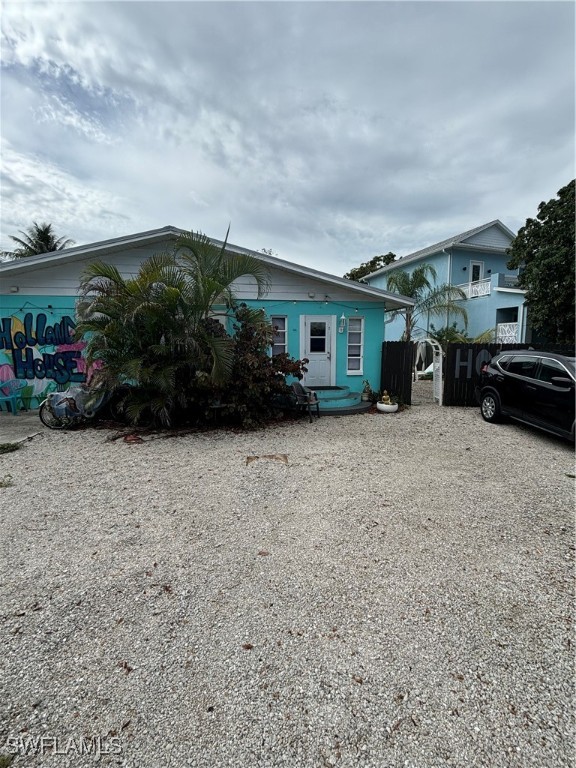 3048 Lunar Street Naples, FL 34112 - Photo 2 of 19 front view of house with a yard