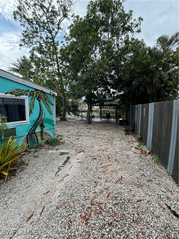 3048 Lunar Street Naples, FL 34112 - Photo 5 of 19 a backyard of a house with lots of green space