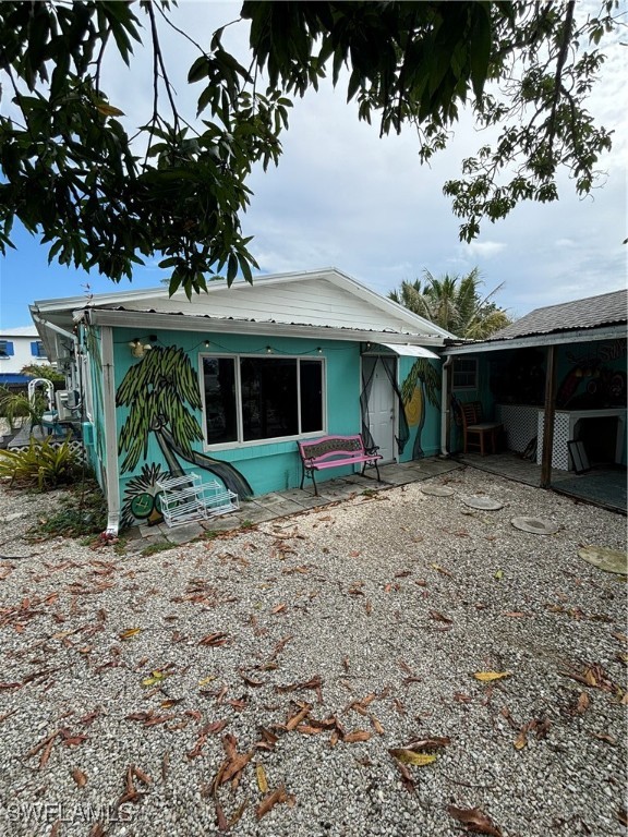 3048 Lunar Street Naples, FL 34112 - Photo 6 of 19 a front view of a house with garden