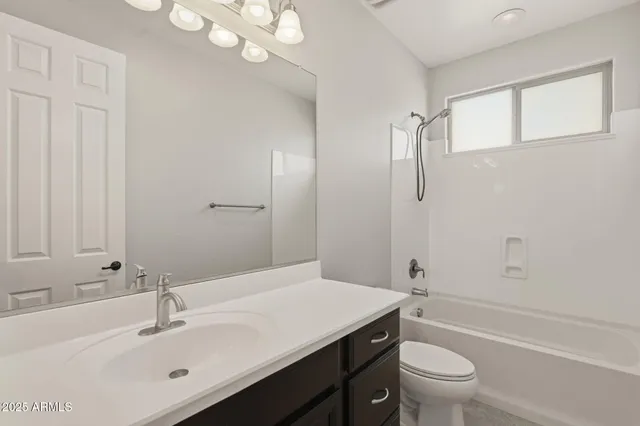 a view of a bathroom with a sink and a mirror
